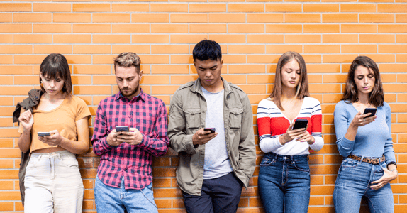 Group of Gen Z taking part in market research on their phones