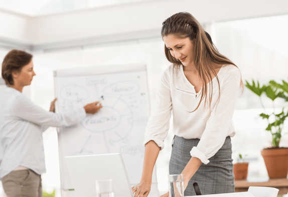 Two colleagues preparing a brief for their chosen market research recruiting agency.