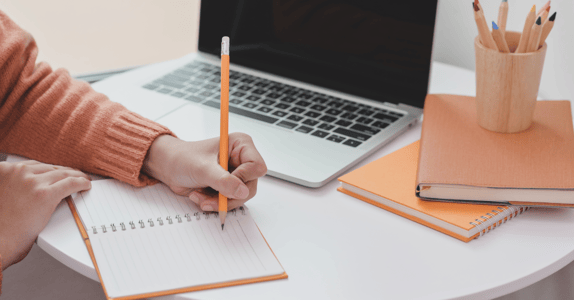 person preparing to write market research screener