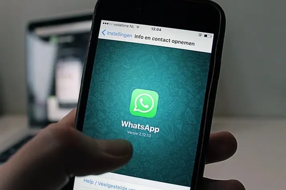 Phone screen displaying WhatsApp as part of online qualitative research