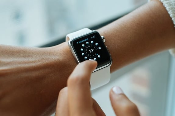 Smartwatch on wrist to represent wearable technologies in market research